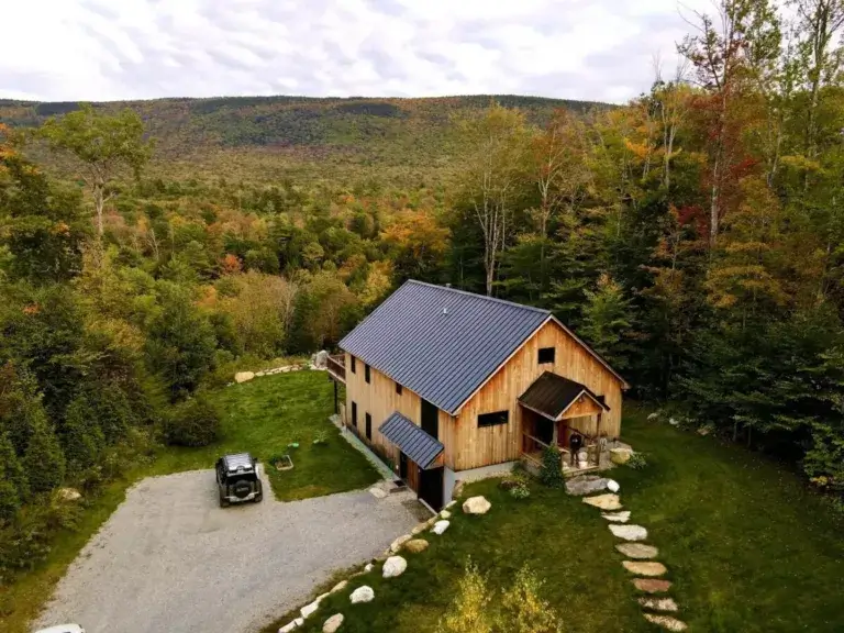 Modern wood Skyline Cabin rental overlooking expansive Green Mountains vista in early autumn, Sunderland, Vermont