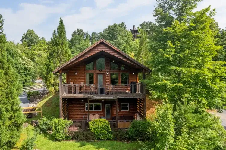 Romantic secluded log cabin Gatlinburg with multiple fireplaces and sunset views