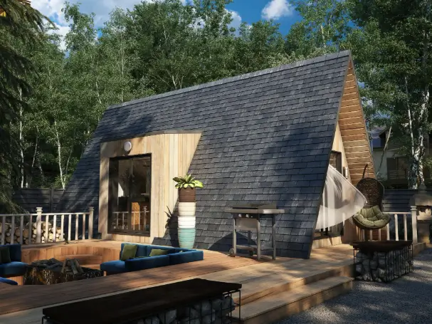 Avrame A-frame kit home featuring a spacious outdoor deck and contemporary lounge furniture.