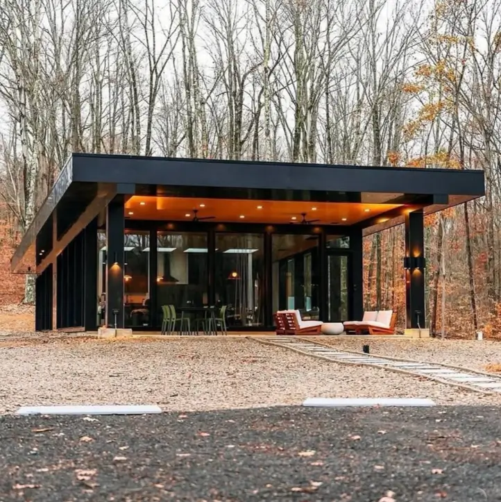 A modern, professionally built tiny home in an Ohio forest, showcasing high-end design and materials.