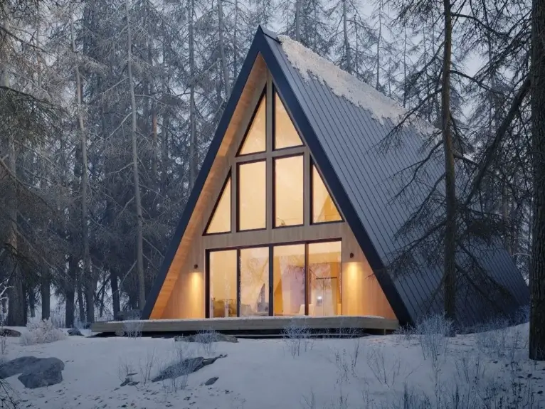 Den Outdoors A-frame cabin project, a modern A-frame nestled in a snowy forest landscape.