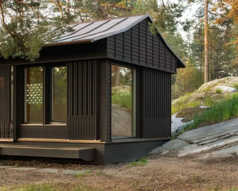 Unique wooden cabin exterior with delicate sliding screens, blending Japanese tea house aesthetics with Scandinavian simplicity.