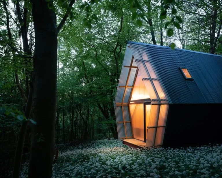 Mobile and sustainable house prototype exterior built with recycled materials, featuring corrugated fiberglass and steel.