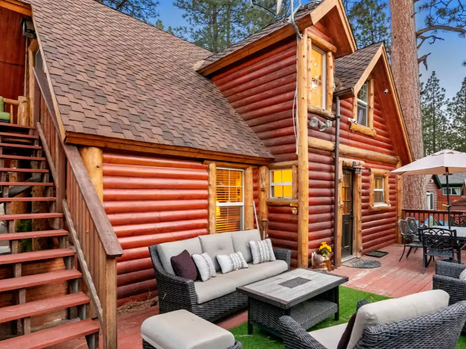 A stylish outdoor living set on the expansive deck of a Big Bear mountain retreat.