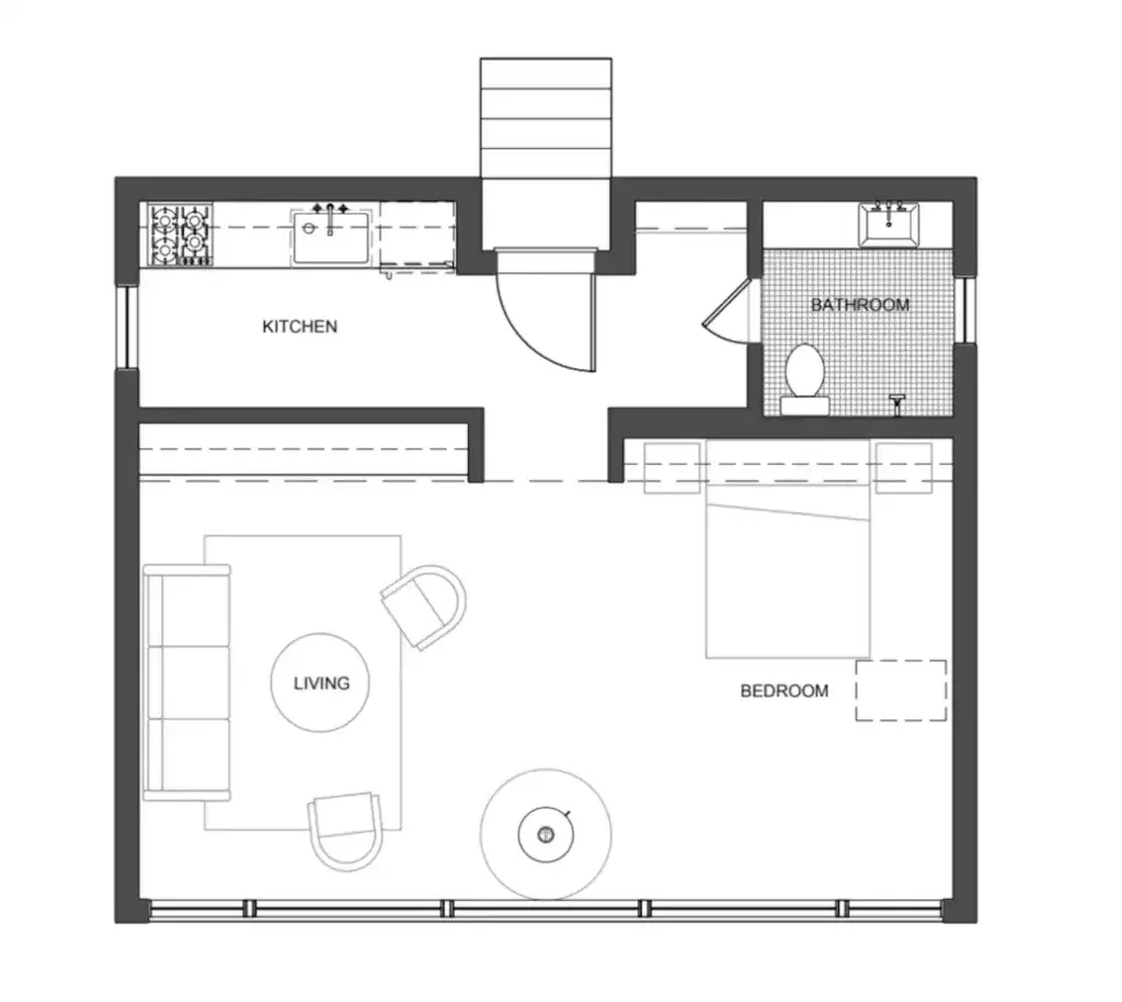 A detailed floor plan of a 600 sq ft tiny house showing an open-concept living room, kitchen, one bedroom, and a bathroom.