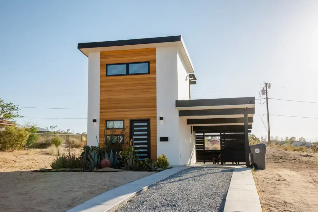 Front view of the modern two-story Casita Conejo tiny house in Joshua Tree, the subject of an honest rental review and booking guide.