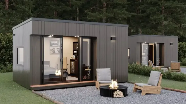 The Sixteen BnB by Mini Office, a modern grey modular guest unit, a prefab home for under 50k with outdoor seating.