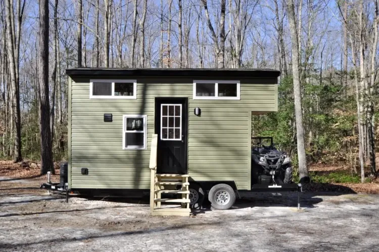 The Timberland gooseneck tiny home in sage green, a practical prefab home for under 50k.