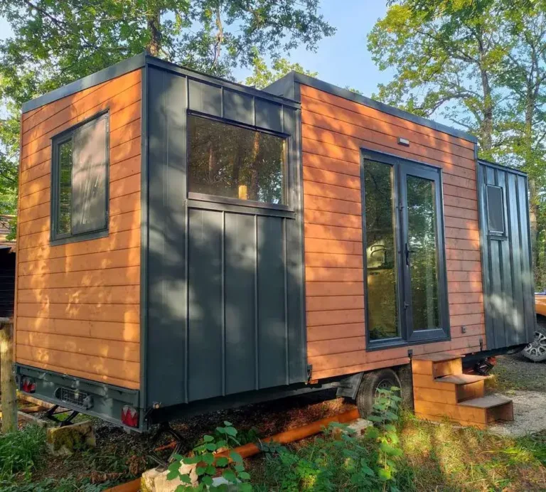 The Escapehouse 659, a modern tiny home on wheels with wood and metal siding, a prefab home for under 50k.