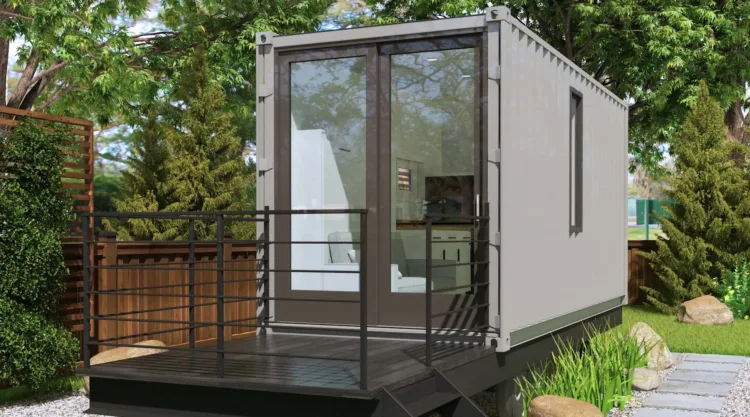 The Alt 20-foot shipping container home, a grey modular home for under 50k with a wooden deck.