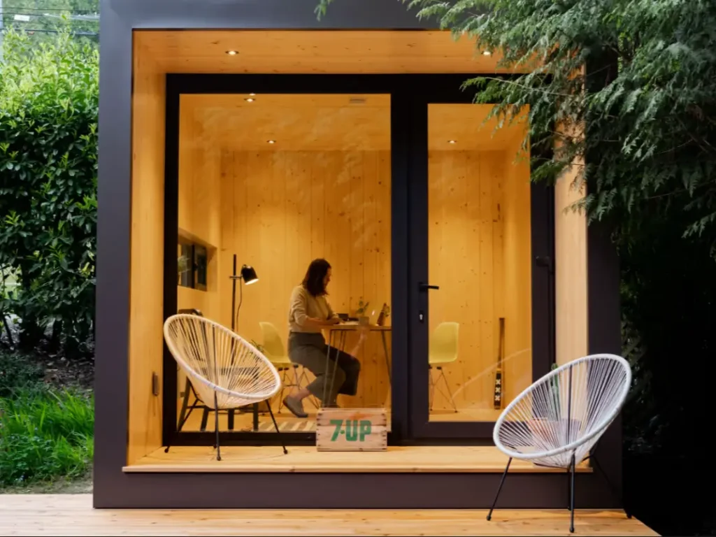 The 146 backyard office pod with a wood interior and glass front, a stylish prefab studio for under 50k.