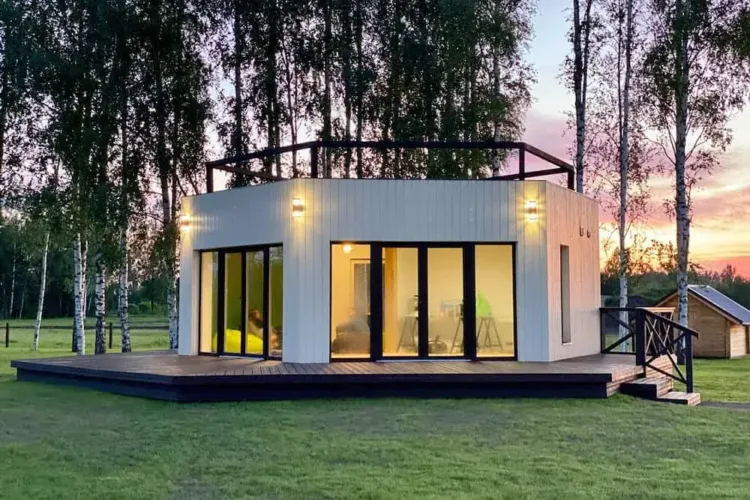 The Šuuna Bee House, a unique hexagonal prefab home with a rooftop deck, an affordable modular home under 50k.
