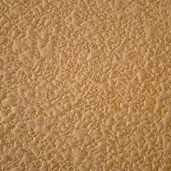 Close-up of subtle orange peel wall texture painted a neutral beige, a popular choice among wall texture types.