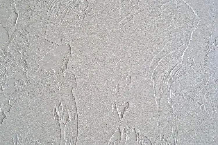 Elegant sand swirl wall texture with gentle, flowing patterns, a subtle choice for interior wall texture types.