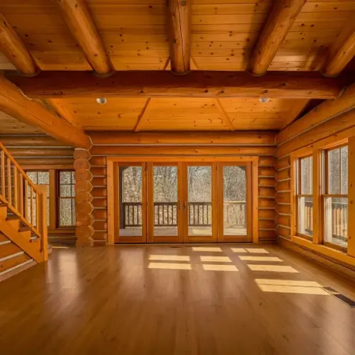 A bright and airy log cabin interior with clean walls and gleaming wood surfaces, showcasing the results of proper cleaning and maintenance.

How to Clean Log Cabin Interior Walls