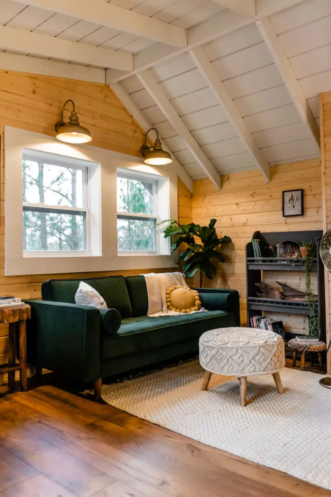 A plush velvet loveseat and cozy reading nook with a bookshelf await you in the loft.