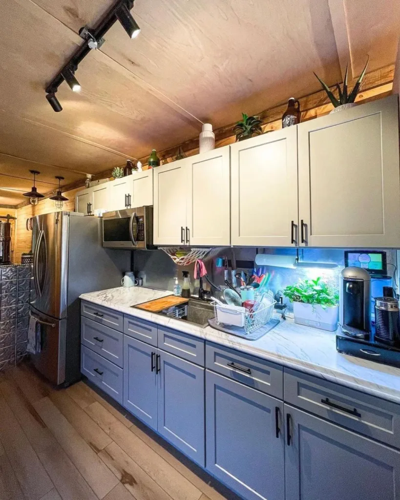 The kitchen is equipped with modern appliances, ample storage space, and stylish cabinetry.