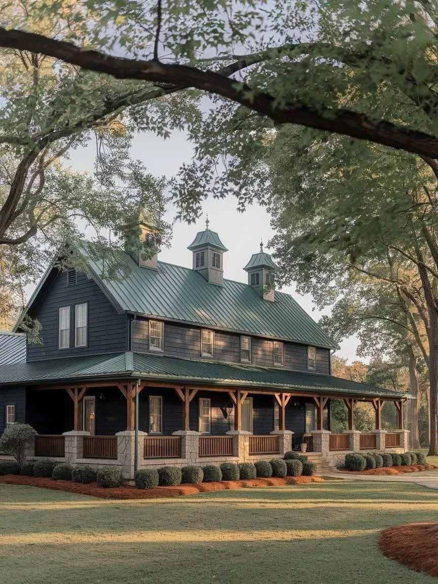 Dark-sided farmhouse with a green metal roof, wrap-around porch, and natural wood accents.