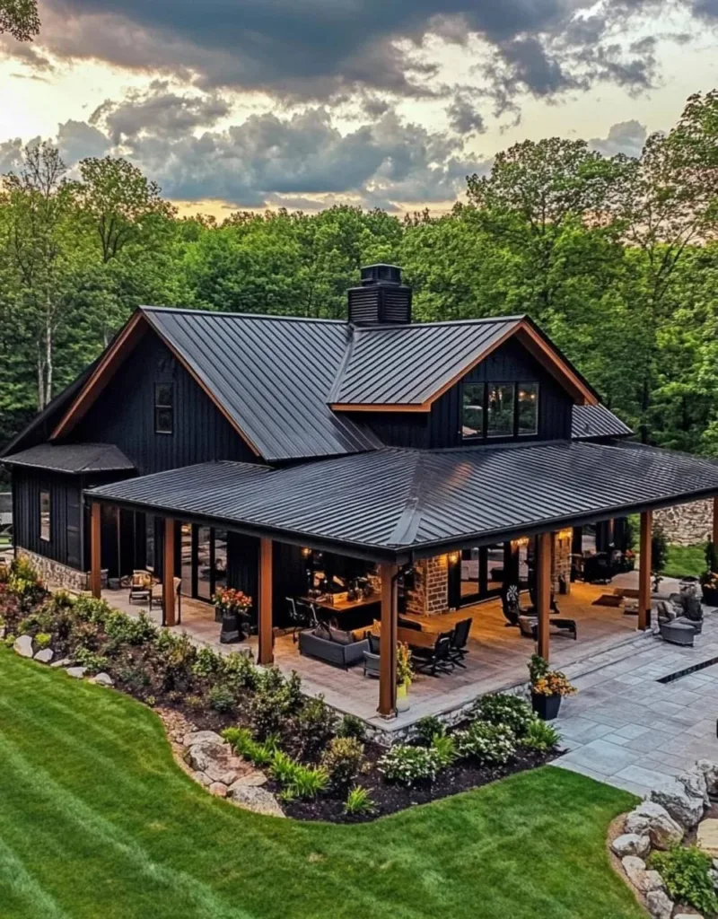 Aurora Farmhouse with white siding, a stone base, a wrap-around porch, and a black roof.