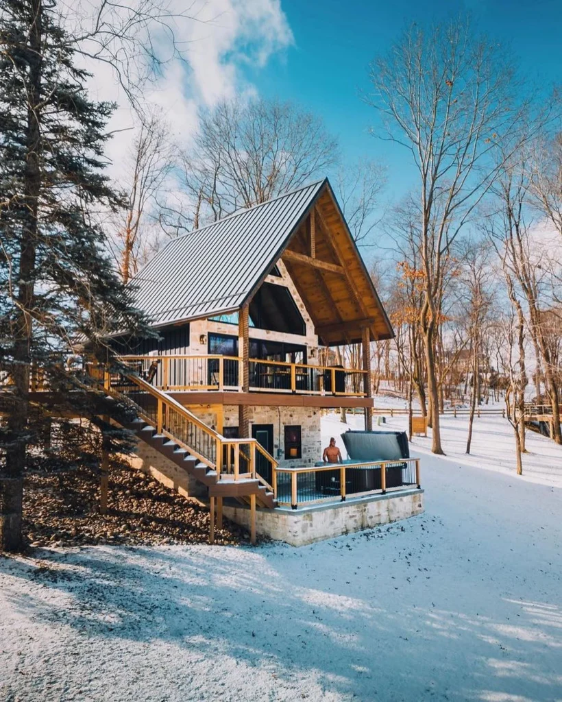 Dreamy cabin in the woods with high ceilings and wrap-around deck.