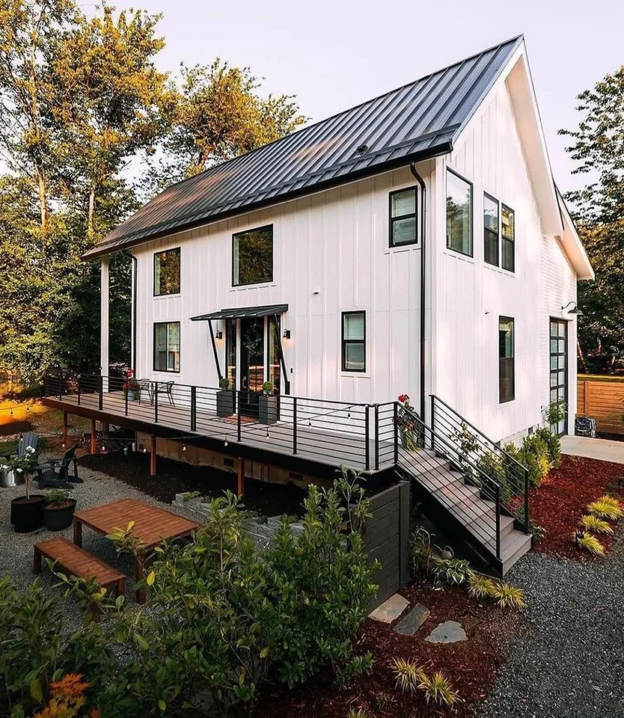 Dreamy white modern farmhouse cabin with wrap-around deck.