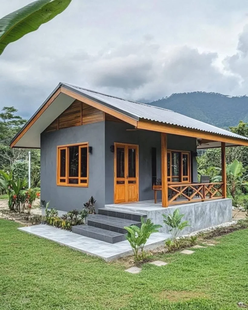 Modern tropical wooden cottage with rustic wood accents and a covered porch.