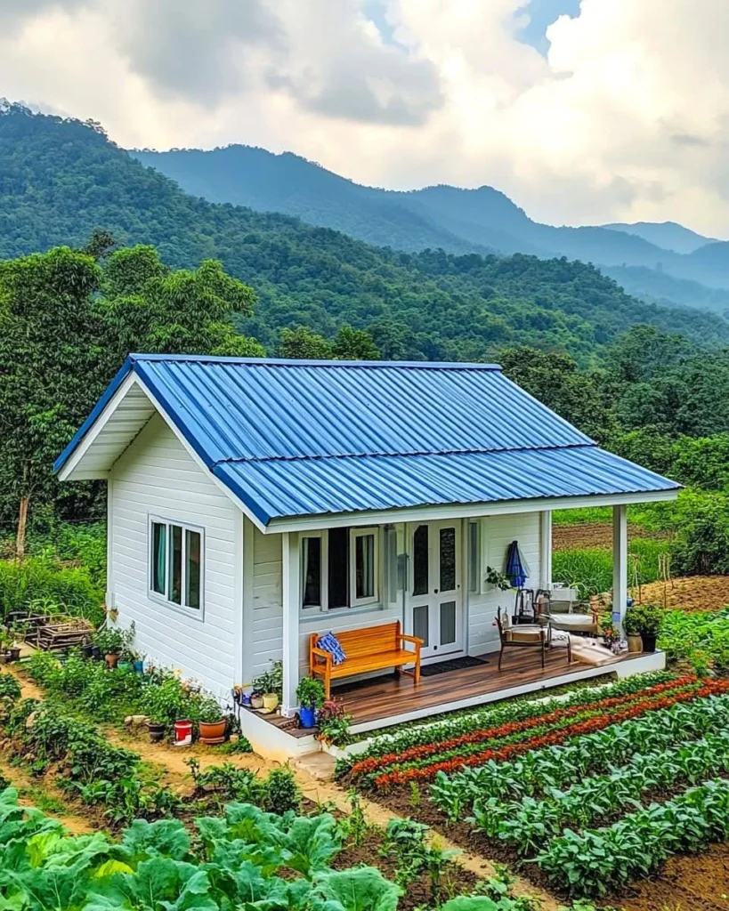 Charming tropical wooden cottage with a blue gabled roof and front porch. tropical wooden house