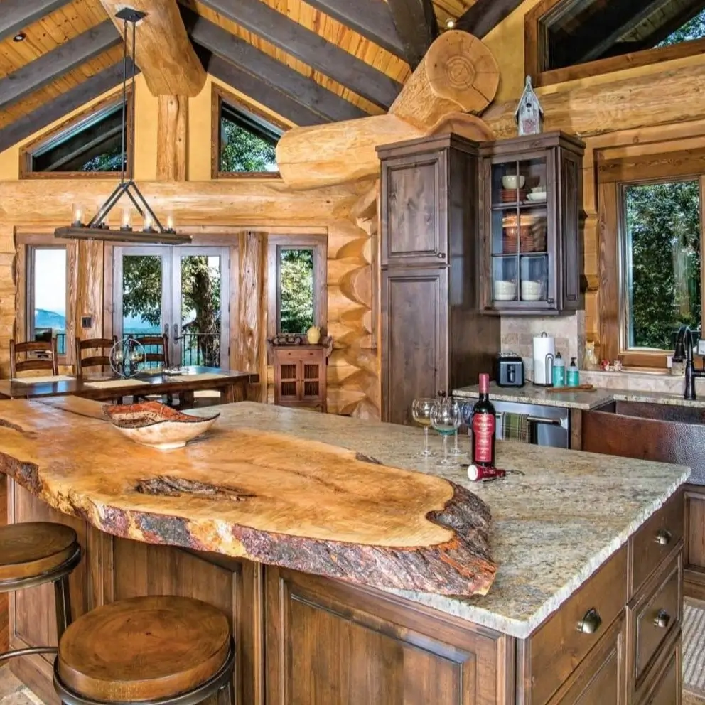 Log cabin kitchen with a large live-edge wood island and exposed log beams.