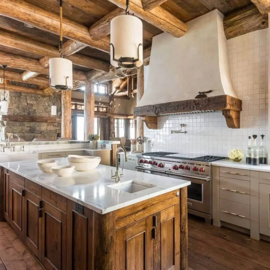 Modern log cabin kitchen with a large wood island, marble countertop, and exposed logs.