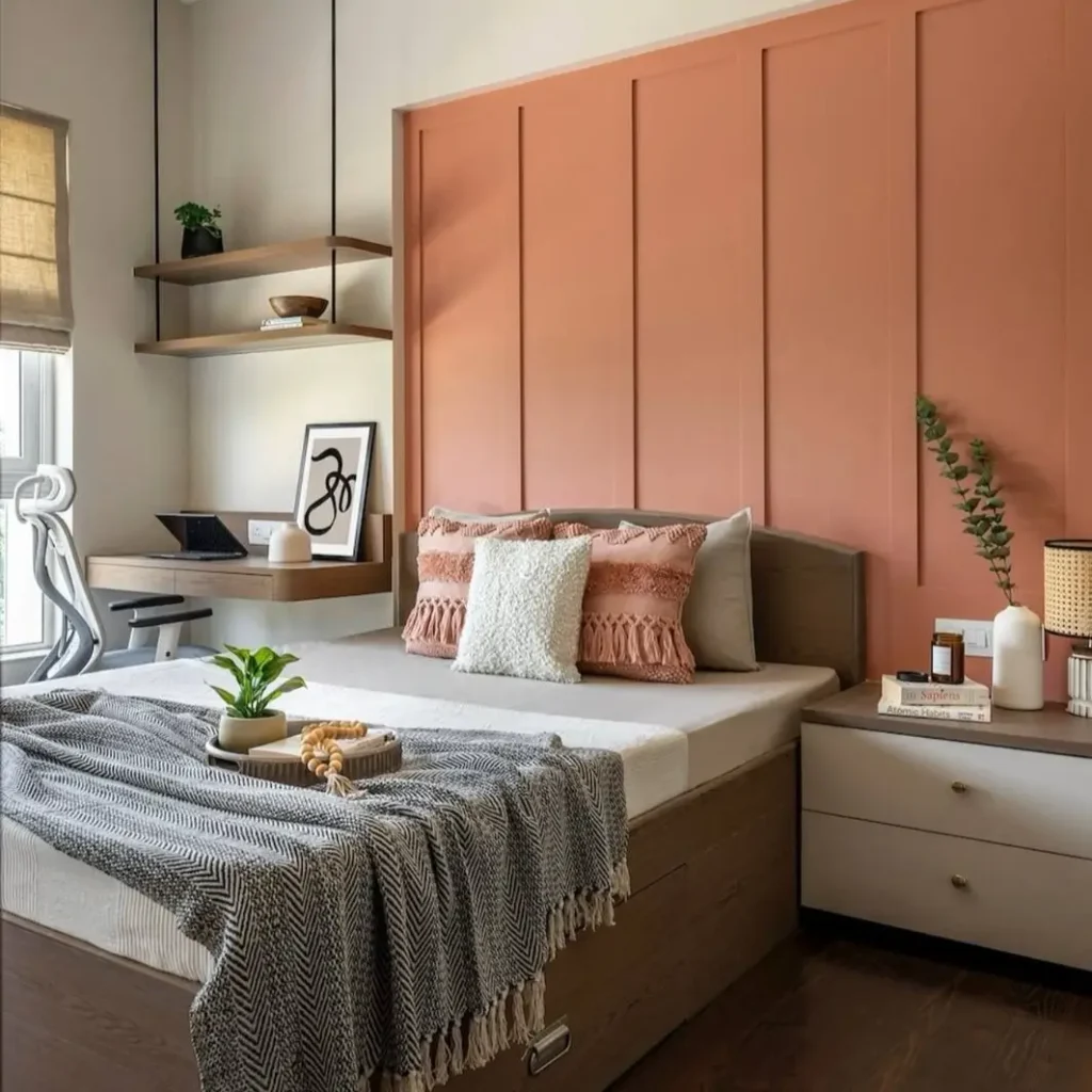 A bedroom corner transformed into a workspace with a built-in desk, an example of a simple small apartment decorating idea.
